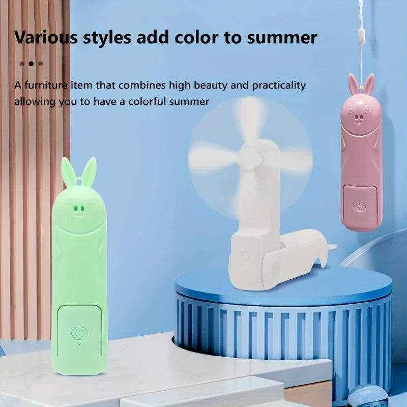 Mini Fan - Three bunny-styled portable fans in green, white, pink in folded and unfolded positions on a blue display