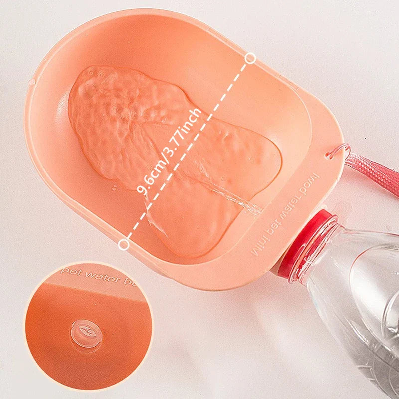 Pet Travel Drinking Water Bowl - Top-down view of peach drinking head with water inside, 9.6cm dimension line, inset showing the bottom drain valve, attached to a clear bottle.