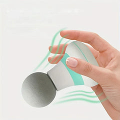 Percussion Massage Gun - Hand holding a small handheld massager with a round gray massage head and vibration motion lines.
