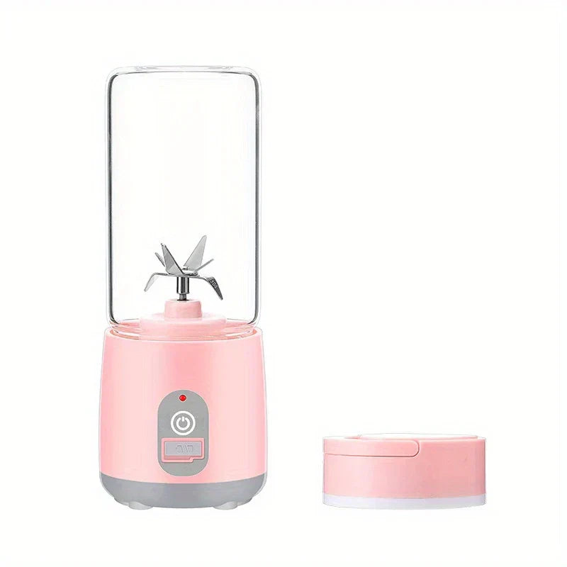 Portable Blender - Empty portable pink blender showing internal blade, separate pink lid positioned to the right.