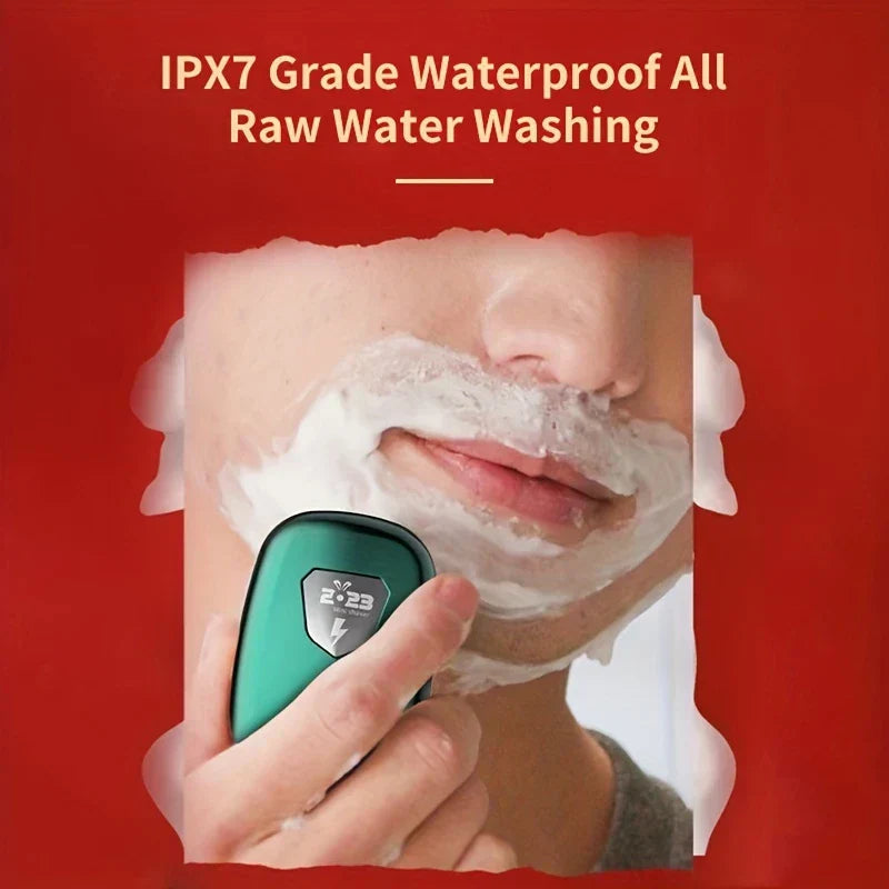 Portable Electric Shaver - Teal shaver held in hand during use with shaving cream, highlighting IPX7 waterproof washable design