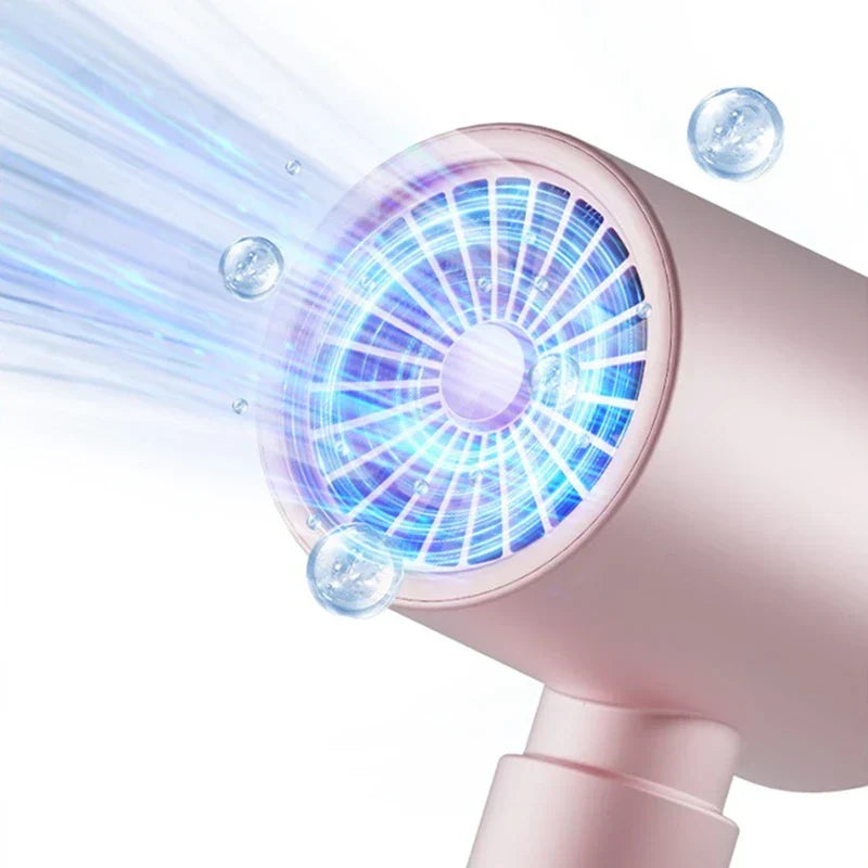 Close-up of a pink hair dryer front emitting air, with visible blue light through the grille and transparent water-like bubbles around the airflow.