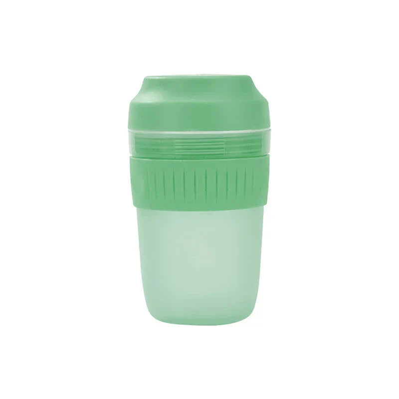 Portable Juicer Blender - Green two-tone portable cup against a plain white background.