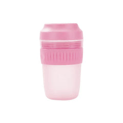 Portable Juicer Blender - Compact pink and translucent plastic lidded cup with ribbed grip band and frosted lower portion.