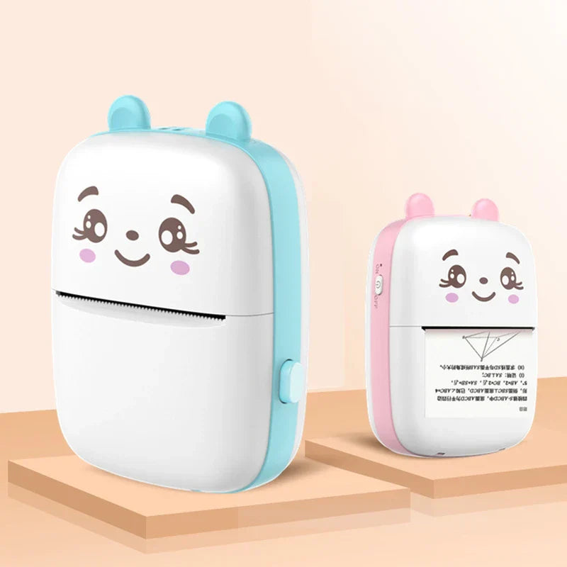 Thermal Printer - Blue and pink cute animal-faced mini printers displayed on raised platforms, one printing a study sheet