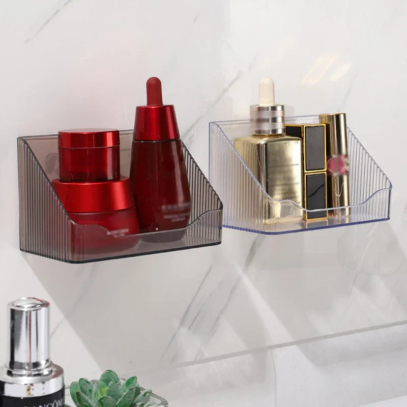 Mirrored Cabinet Organizer Bin - Two wall-mounted storage bins holding skincare and makeup products on a marble tile wall