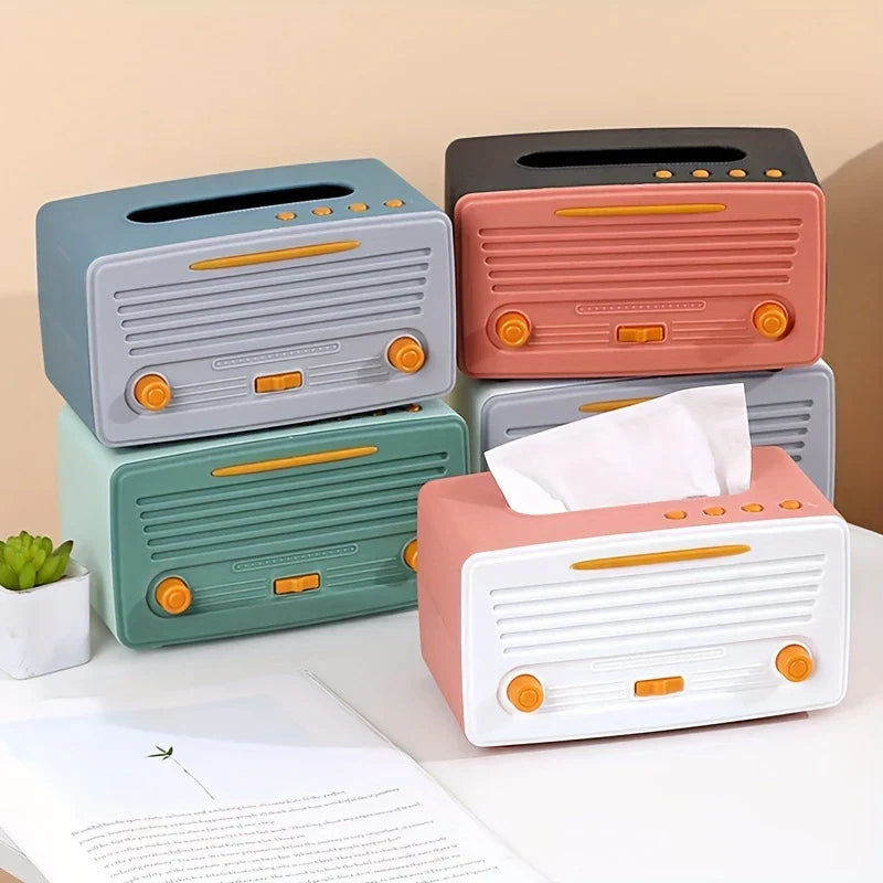Tissue Box Cover - Assorted color retro radio-style holders displayed on a tabletop, one with a tissue pulled through the top slot