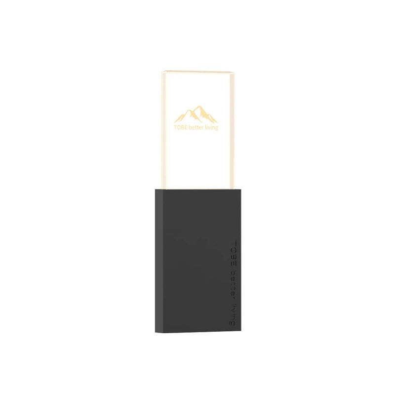 Mosquito Repellent Night Light - Front view of upright 2-in-1 plug-in lamp with dark base and illuminated clear top panel printed with mountain logo