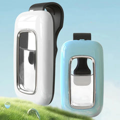 Wearable Mosquito Repellent - White and light blue clip-on devices displayed side by side on grass