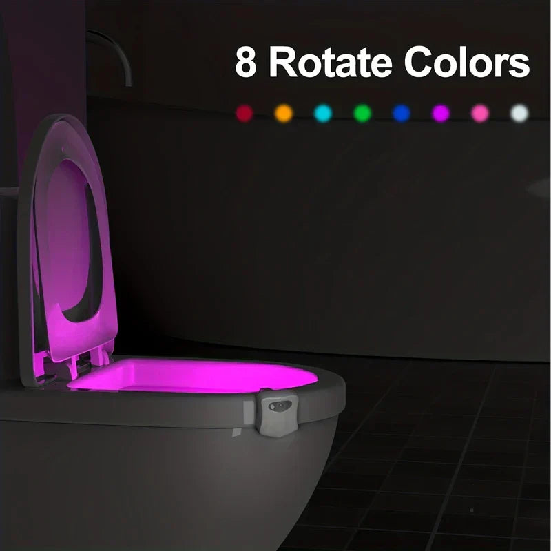 Motion Activated Night Light - Toilet light mounted on a toilet, glowing pink inside the bowl; 8 color swatches displayed above labeled 8 Rotate Colors.