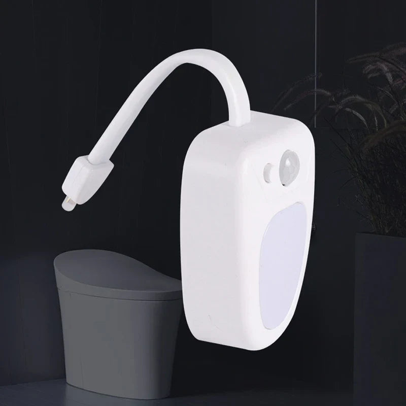 Close-up of the motion sensor toilet bowl light showing its compact design
