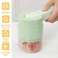 Vegetable Slicer - Hand pressing the power button on the handheld kitchen tool as it chops chili peppers in its clear container, with feature callouts on the left
