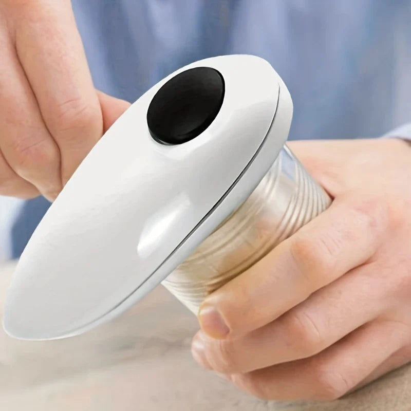 Can And Bottle Opener - Close-up of two hands: one gripping the white handheld opener, the other holding a can being opened