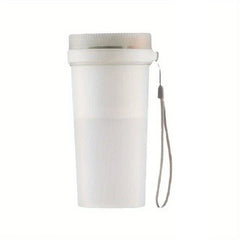 Matte white ribbed portable juicer blender with a matching lid and grey wrist lanyard, shown against a plain white background.