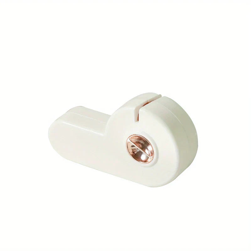 Manual Knife Sharpener - Cream white compact kitchen sharpening tool with rose gold adjustment dial, angled front view on plain white background