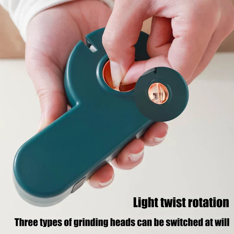 Manual Knife Sharpener - Hands twist the rose gold knob on the dark teal tool, lifting the cover to show its internal compartment