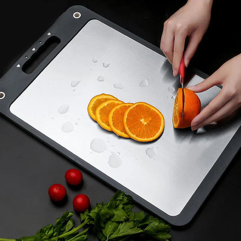 Stainless steel cutting board defrost tray with frozen meat placed on top