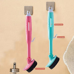 Kitchen Cleaning Brush - Pink and teal liquid-dispensing dish brushes hanging on adhesive wall hooks, with labeled feature callouts