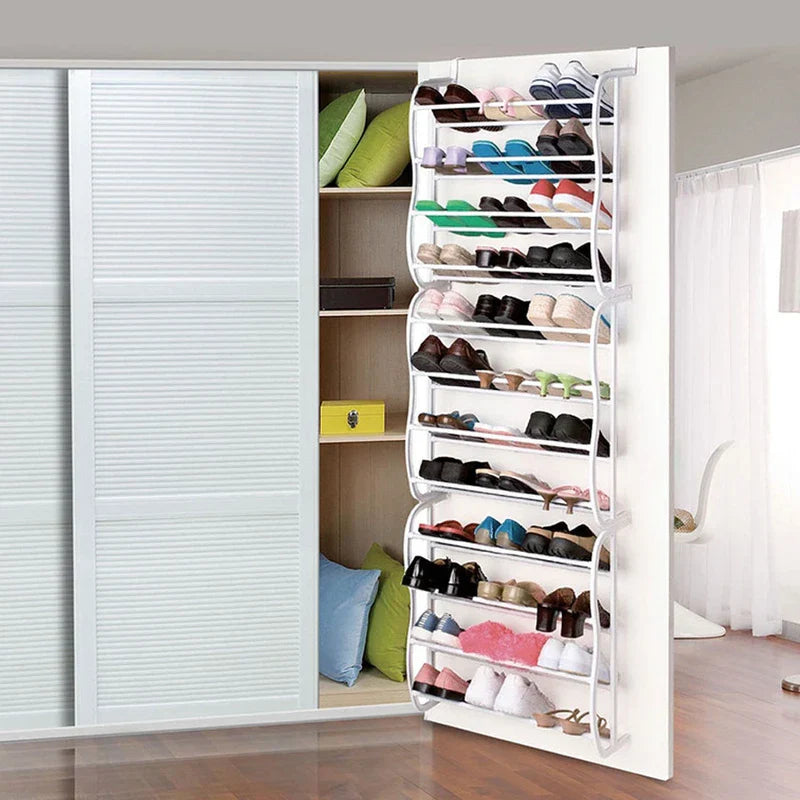 Shoe Rack - Unit installed on the back of a closet door holding assorted pairs of footwear