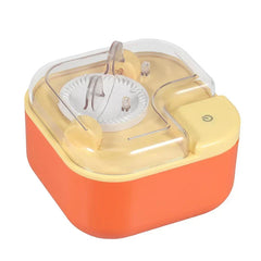 Dumpling Maker Press - Compact two-tone orange and pale yellow electric kitchen gadget with clear lid and power button