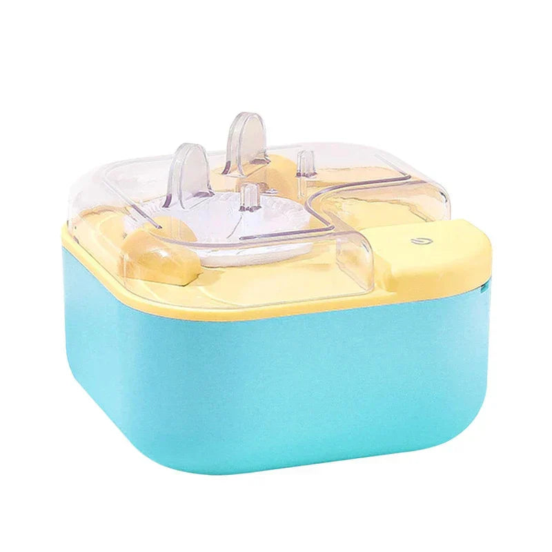 Dumpling Maker Press - Small square electric kitchen appliance with light blue base, yellow top, and clear plastic lid