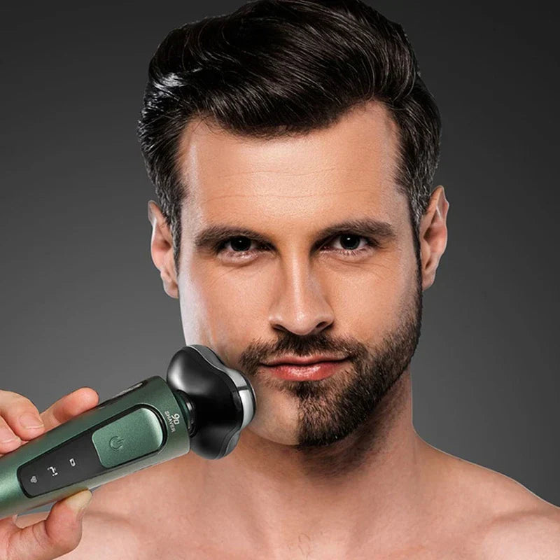 Man holds an electric shaver against half his beard to demonstrate shaving