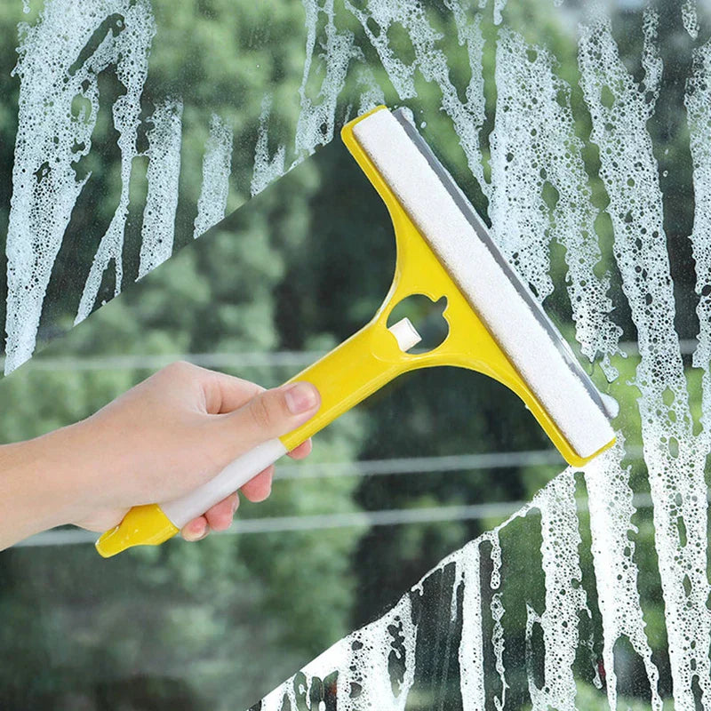 Window Squeegee Cleaner - Hand holding a yellow and white window squeegee wiping suds from a glass surface