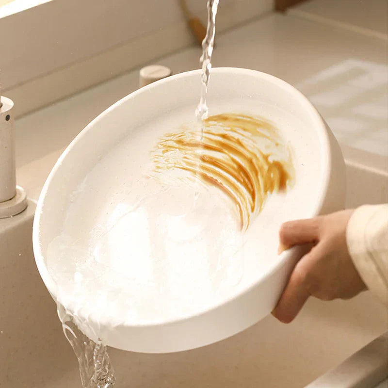 Rotating Storage Turntable Tray Organizer - Hand rinsing soapy residue from a white round tray under running sink water