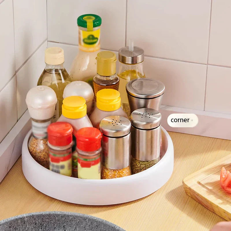 Rotating Storage Turntable Tray Organizer - White rotating tray holding various spice bottles in a kitchen corner
