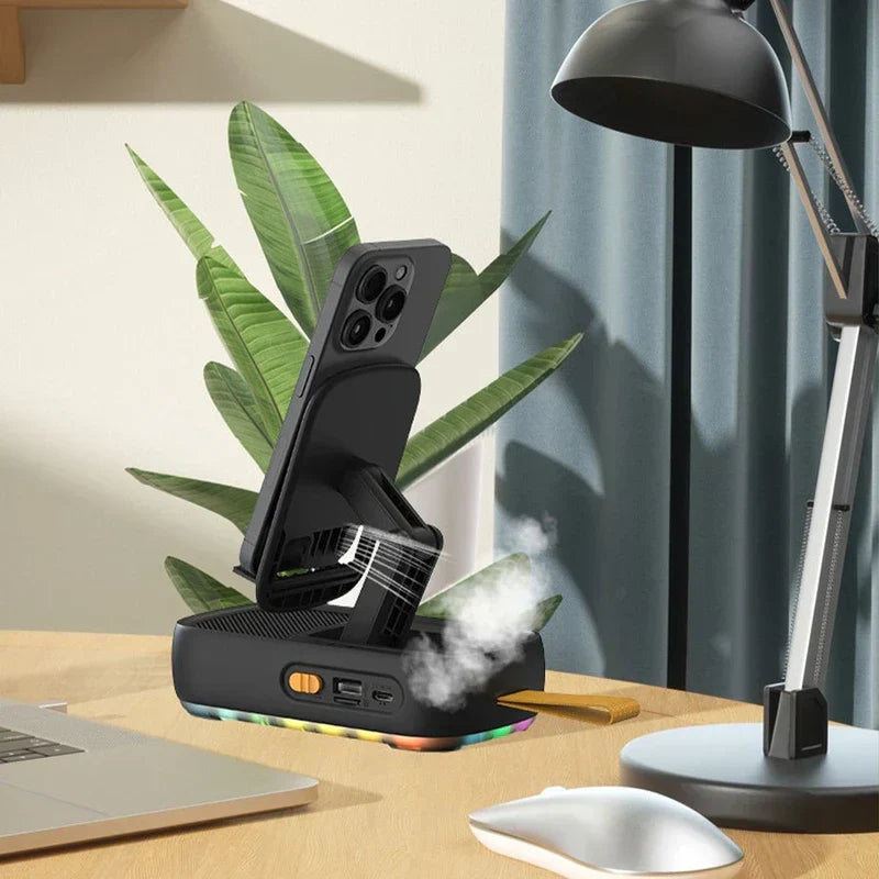 soporte multifuncional con base y montaje - soporte multifuncional negro con base y montaje sosteniendo un teléfono inteligente, con vapor visible cerca de su base sobre un escritorio junto a portátil y lámpara de escritorio