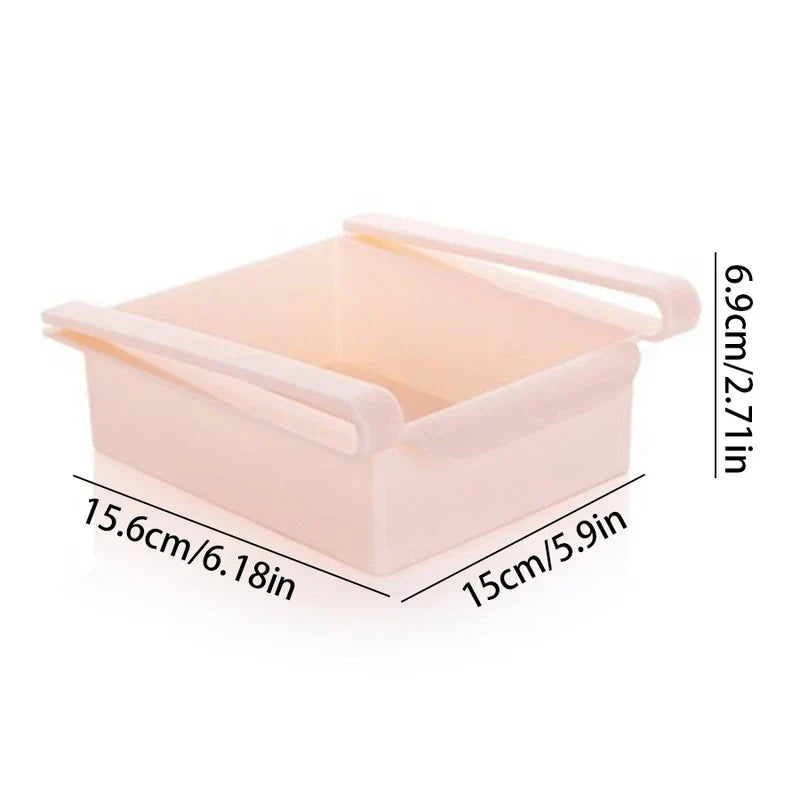 Storage Box Organizer - Light pink plastic under-shelf storage tray with sliding rails, dimension labels: 15.6cm x 15cm x 6.9cm.