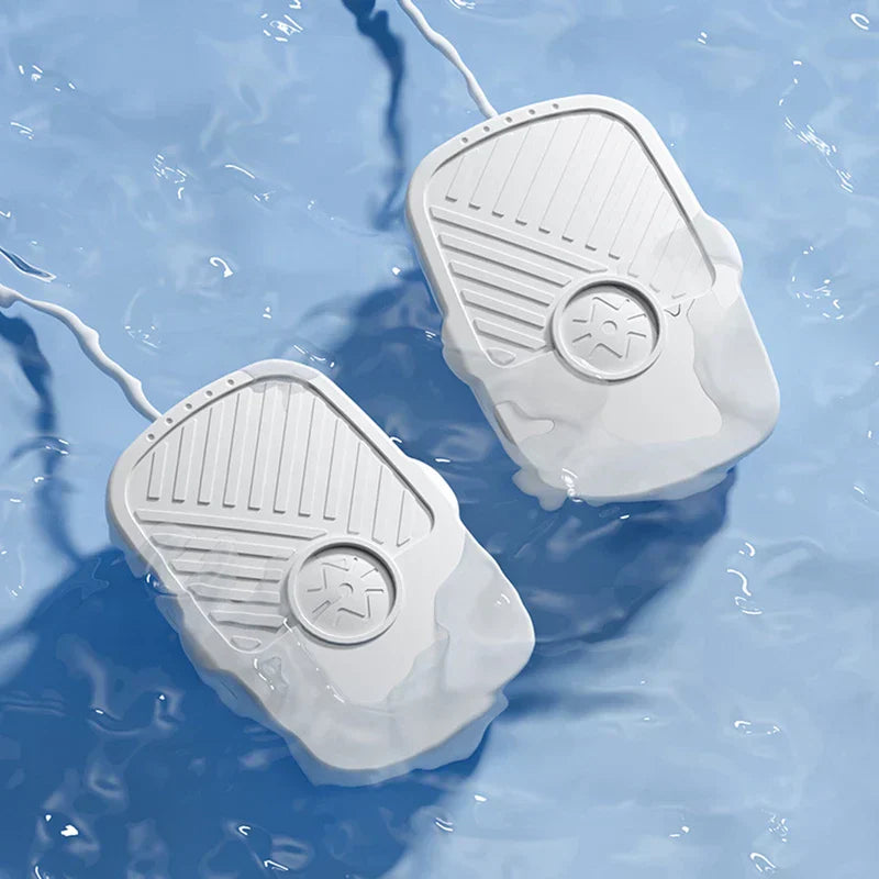 Ultrasonic Cleaner Machine - Two identical white ribbed wired devices partially submerged in light blue rippled water.