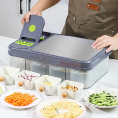 Vegetable Slicer - Unit in use on kitchen counter with assorted cut produce arranged on plates nearby