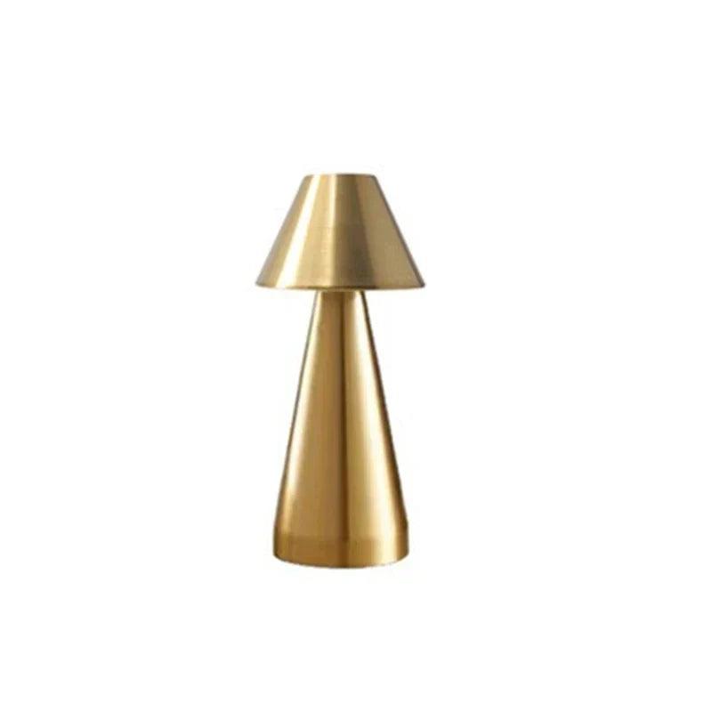 Desk Light - Brushed gold metallic mushroom-style cordless lamp, unlit, against plain white background