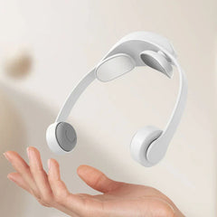 Neck Shoulder Massager - Lightweight white massage device held above an open palm to show compact size