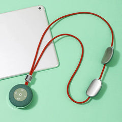 Shiatsu Massager Pillow - Hanging neck massager with red cord, green control unit, two metal massage pads, placed next to a silver tablet on mint green background.