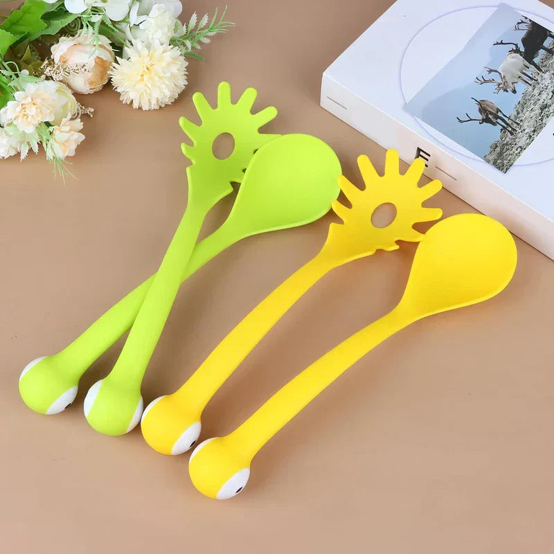 Soup Ladle - Four kitchen utensils (two lime green, two yellow) cross-laid on a brown surface, with artificial flowers and a white box to the side.