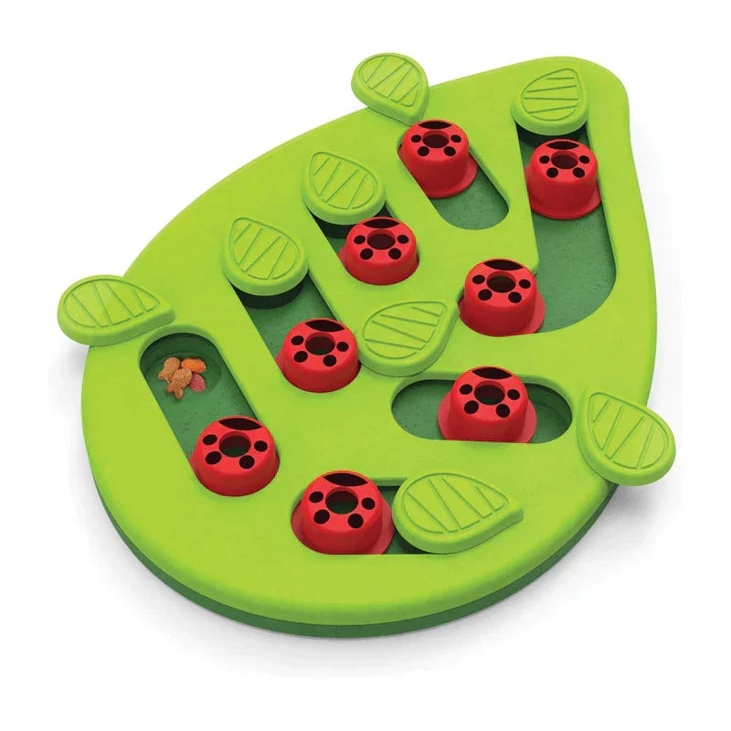 Cat Slow Feeder - Angled view of leaf-shaped green feeding dish with raised leaf details and red sliding covers over food channels