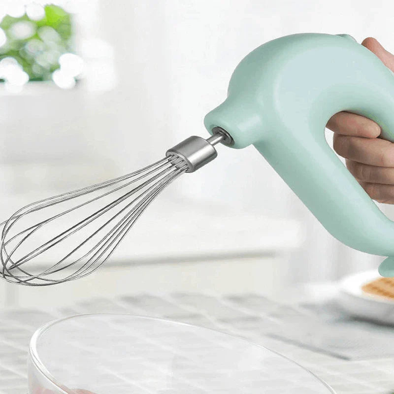 Close-up of the electric hand mixer controls and beaters