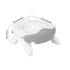 Folding Travel Potty - Foldable travel potty seat with extended support legs, displaying product dimensions in inches and centimeters