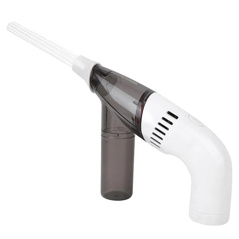 Angled view of a cordless handheld vacuum with a clear dark dust bin and white plastic handle on a white backdrop.