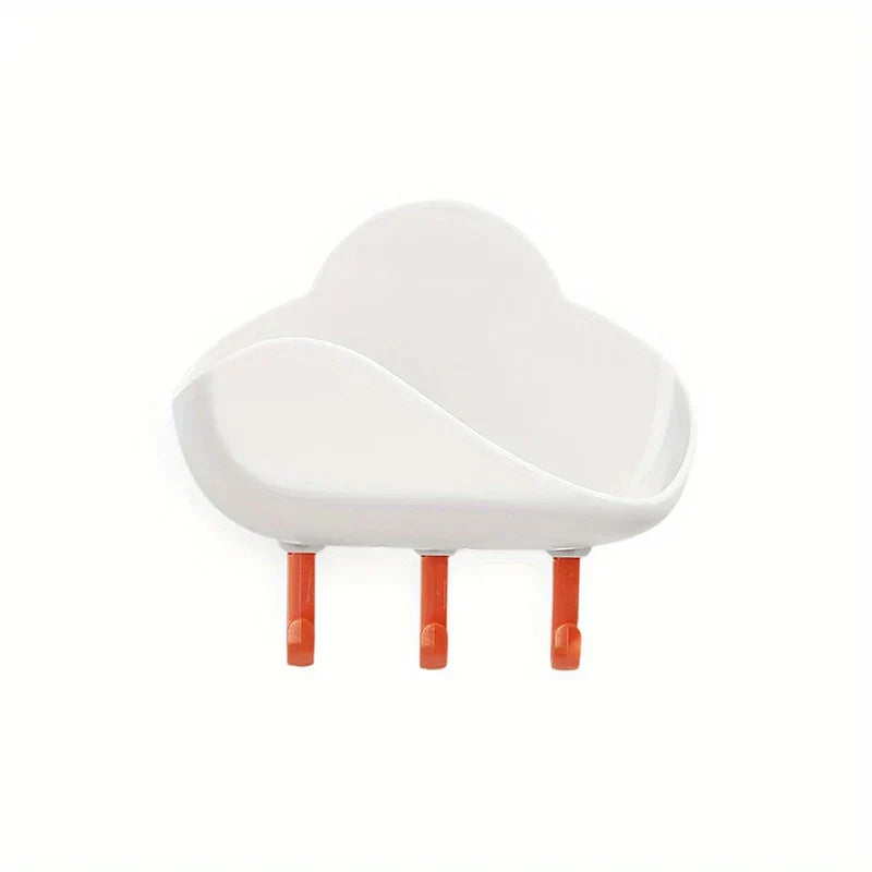 Cloud Wall Hooks - White adhesive wall-mounted storage unit with three orange hanging pegs, curved open top shelf
