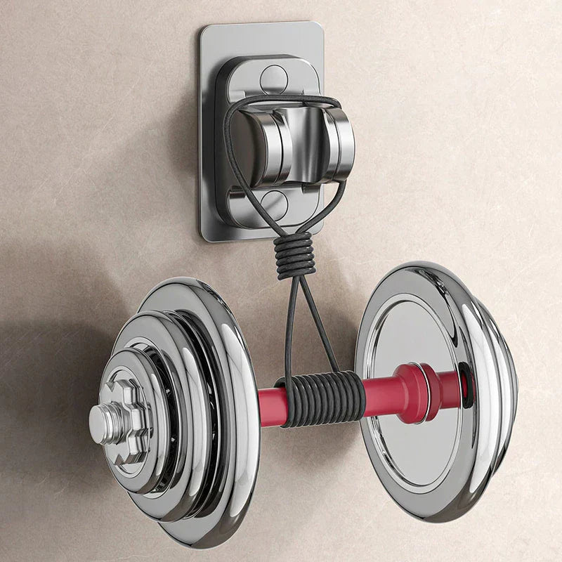 Shower Head Holder Bracket - Wall-mounted hook attached to a textured wall holding a chrome and red dumbbell suspended by black cord