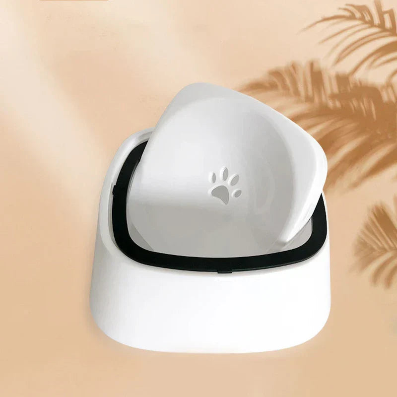 Dog Water Bowl No Spill - White pet water bowl with its floating inner tray lifted, showing a paw print indent on the tray surface