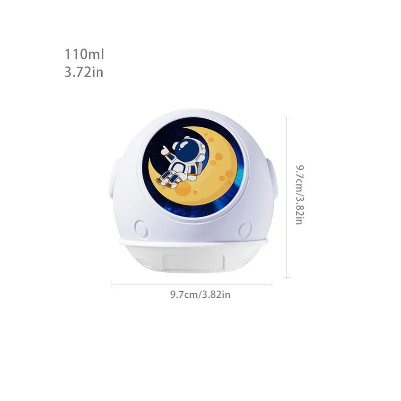Space Theme Mist Maker - White spherical astronaut-themed humidifier with front moon and astronaut graphic, showing capacity 110ml and dimensions 9.7cm by 9.7cm