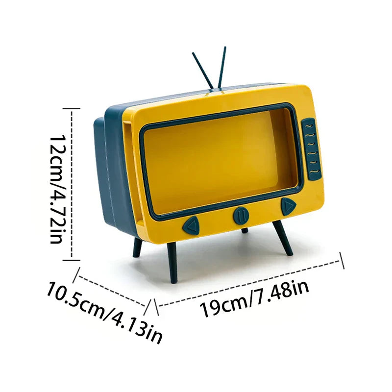 Yellow and dark blue novelty tissue dispenser designed like a retro TV, with height, width, and depth dimension labels.