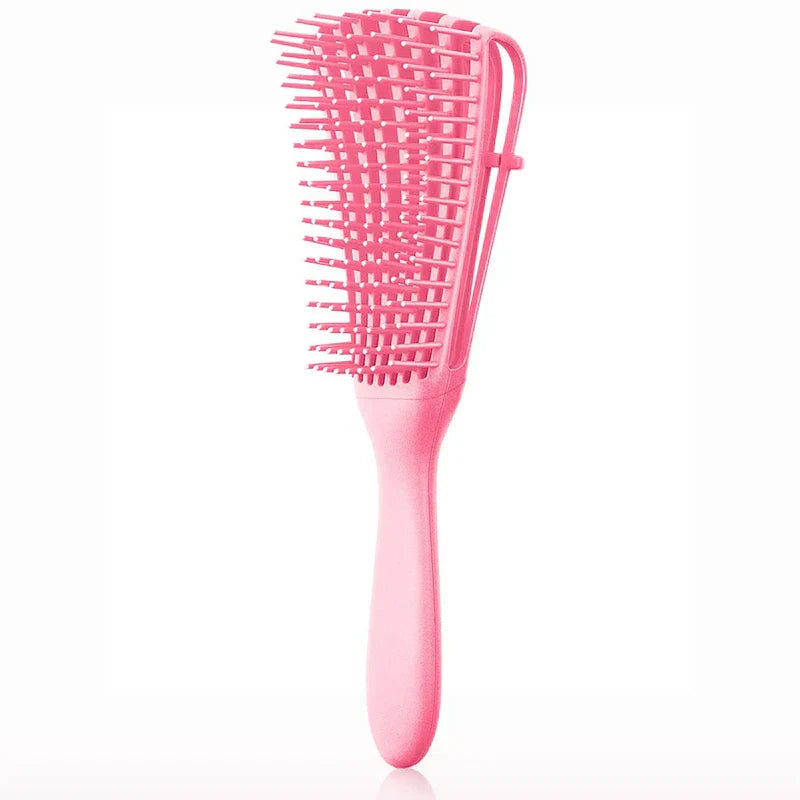 Detangling hair comb held in hand showing easy-grip handle