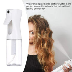 Oil Sprayer - Spray bottle dispensing fine mist next to person with wavy hair demonstrating even spray output
