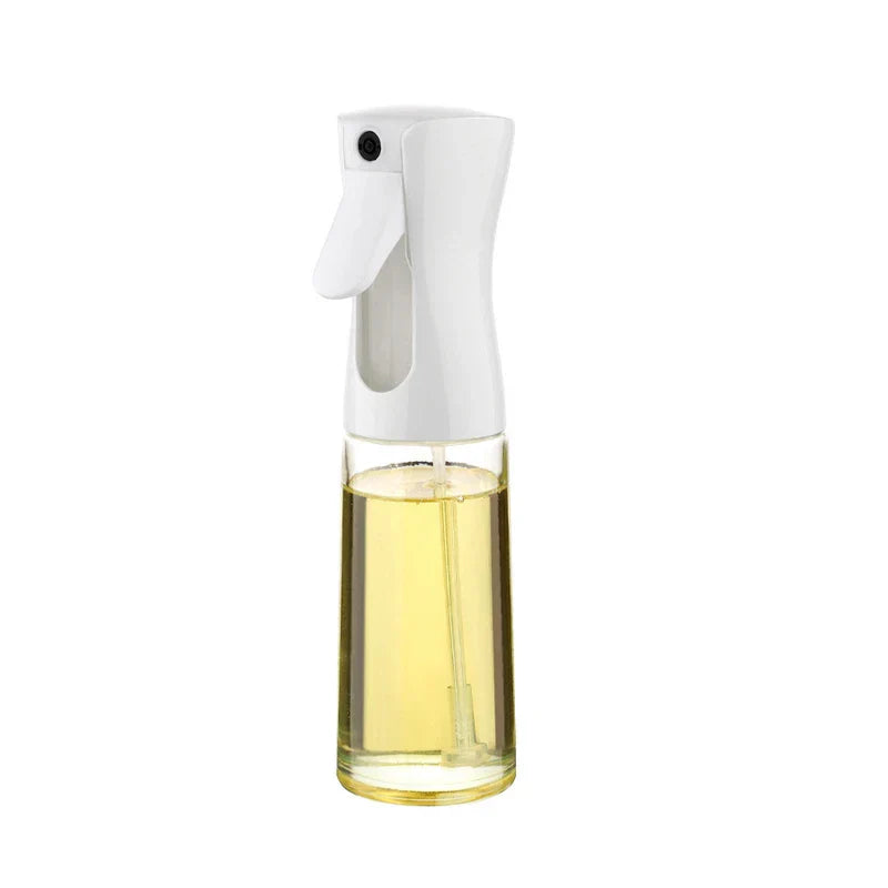 Oil Sprayer - Clear bottle with white spray trigger, partially filled with pale yellow cooking oil, on a plain white background
