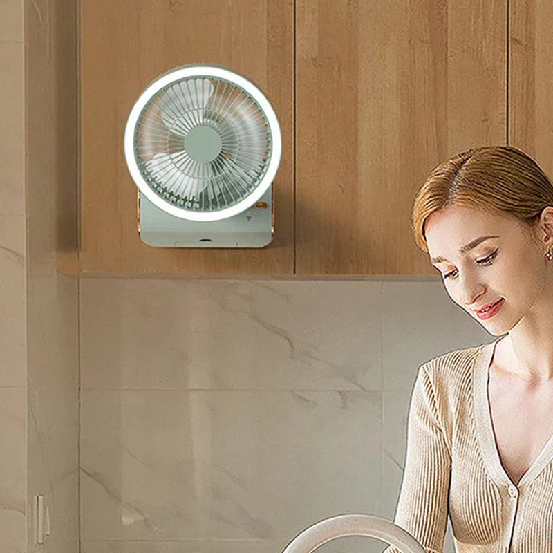 Table Fan - Light green fan with lit ring light mounted under a wooden kitchen cabinet